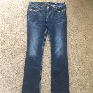 Silver blue jeans with back pocket detail