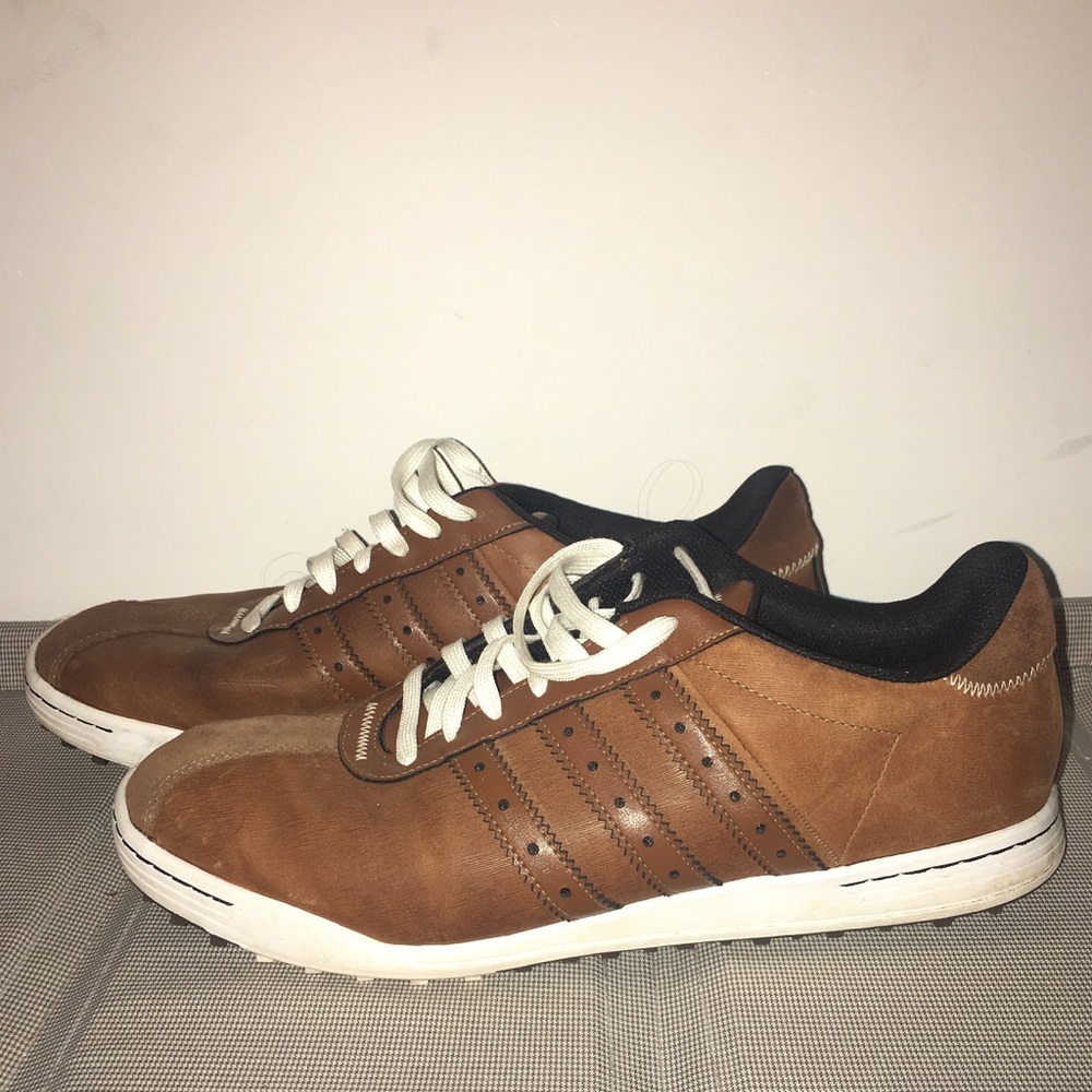 Men's adidas golf shoes and dress shoes.