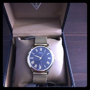 Women's Guess watch gold with black face
