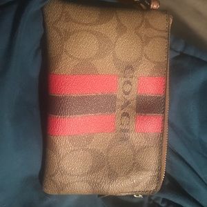 Used coach wristlet in tan and pink colors