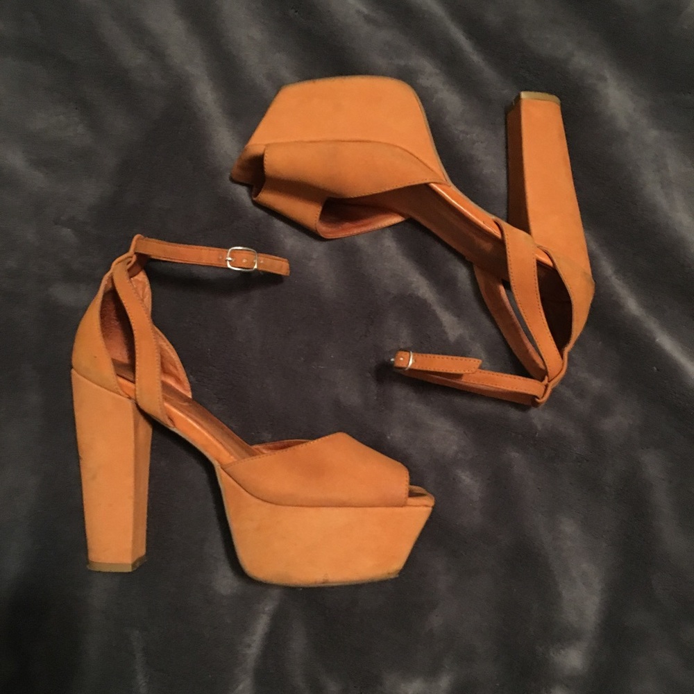 Jeffrey Campbell orange platform sandals.