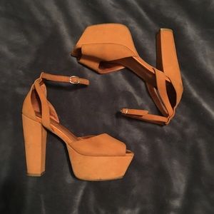 Jeffrey Campbell orange platform sandals.