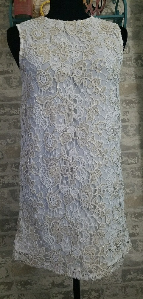 A line white  dress with gold applications