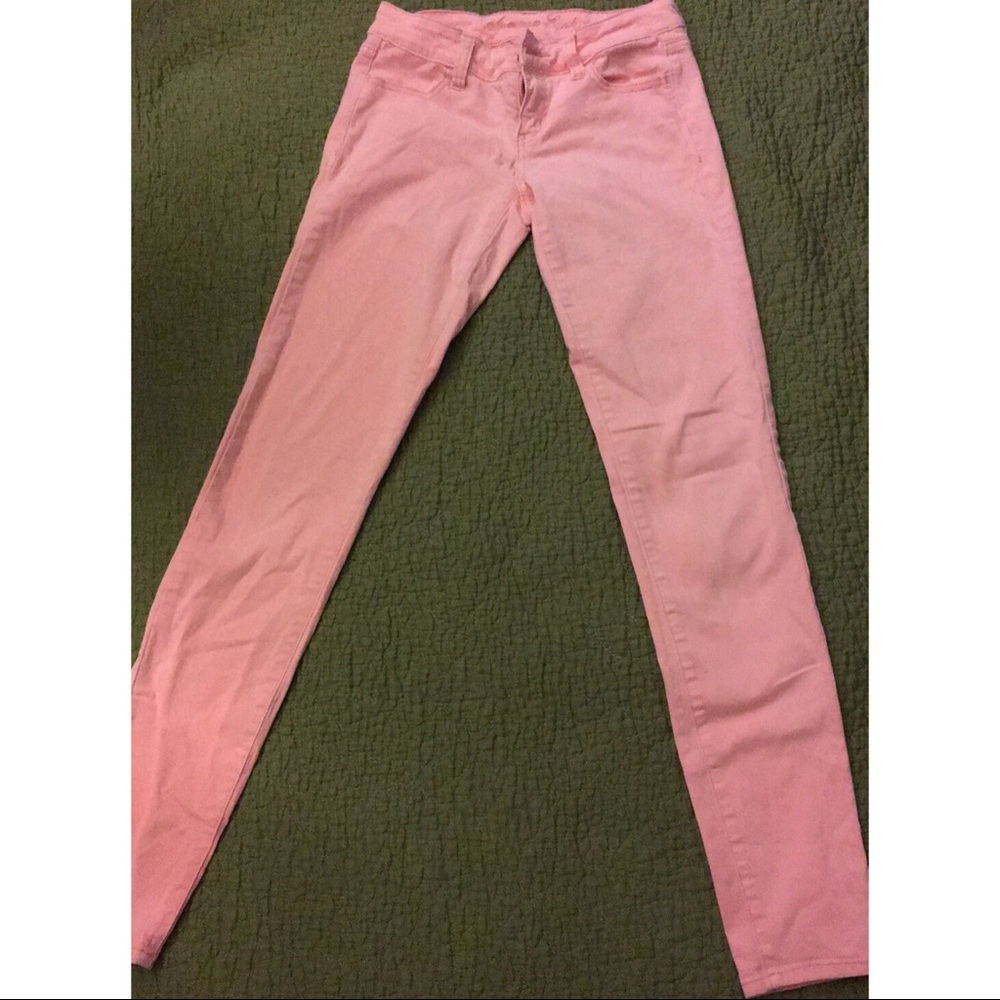 Neon peachy American Eagle jeggings.