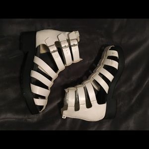 White gladiator style boots.