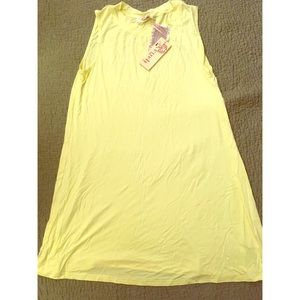 Light yellow sleeveless swing dress/cover up.