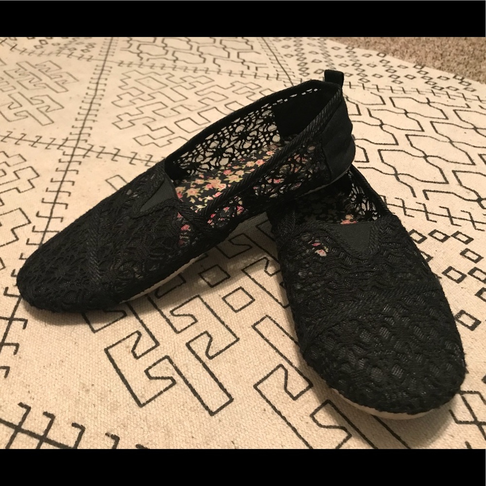 Black lace slip-ons