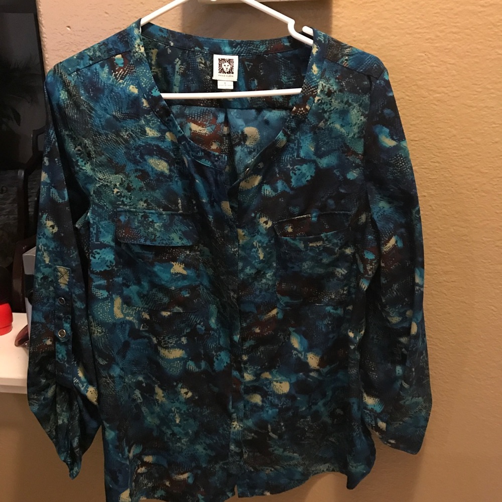 Elegant dark green blouse from Anne Klein .
