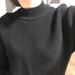 Black turtle neck sweater