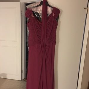 Burgundy gown . Full length