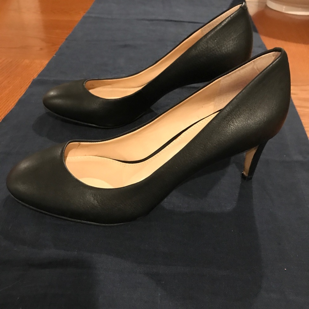 Black leather pumps