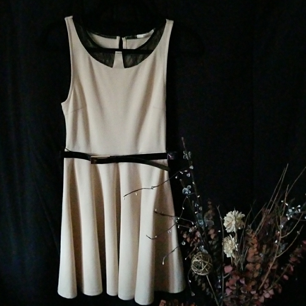 Dress with a black belt around the waist