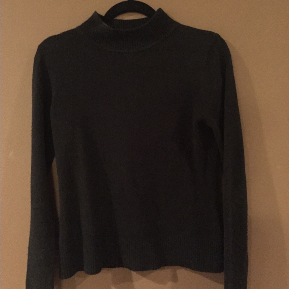 Black mock neck sweater.