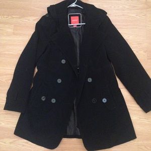 Black hooded rain coat.