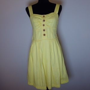 Bright yellow sun dress that has been worn