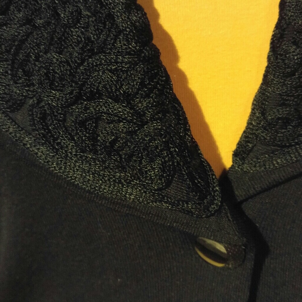 Black embellished cowl neck sweater.