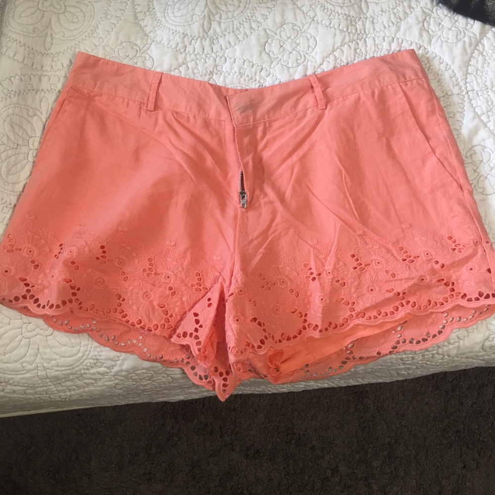 Peach shorts with lace detail at bottom