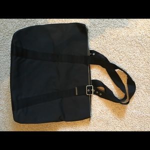 Oversized black tote bag.