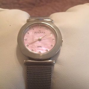 Ladies Skagen watch stainless steel w/ pink face.