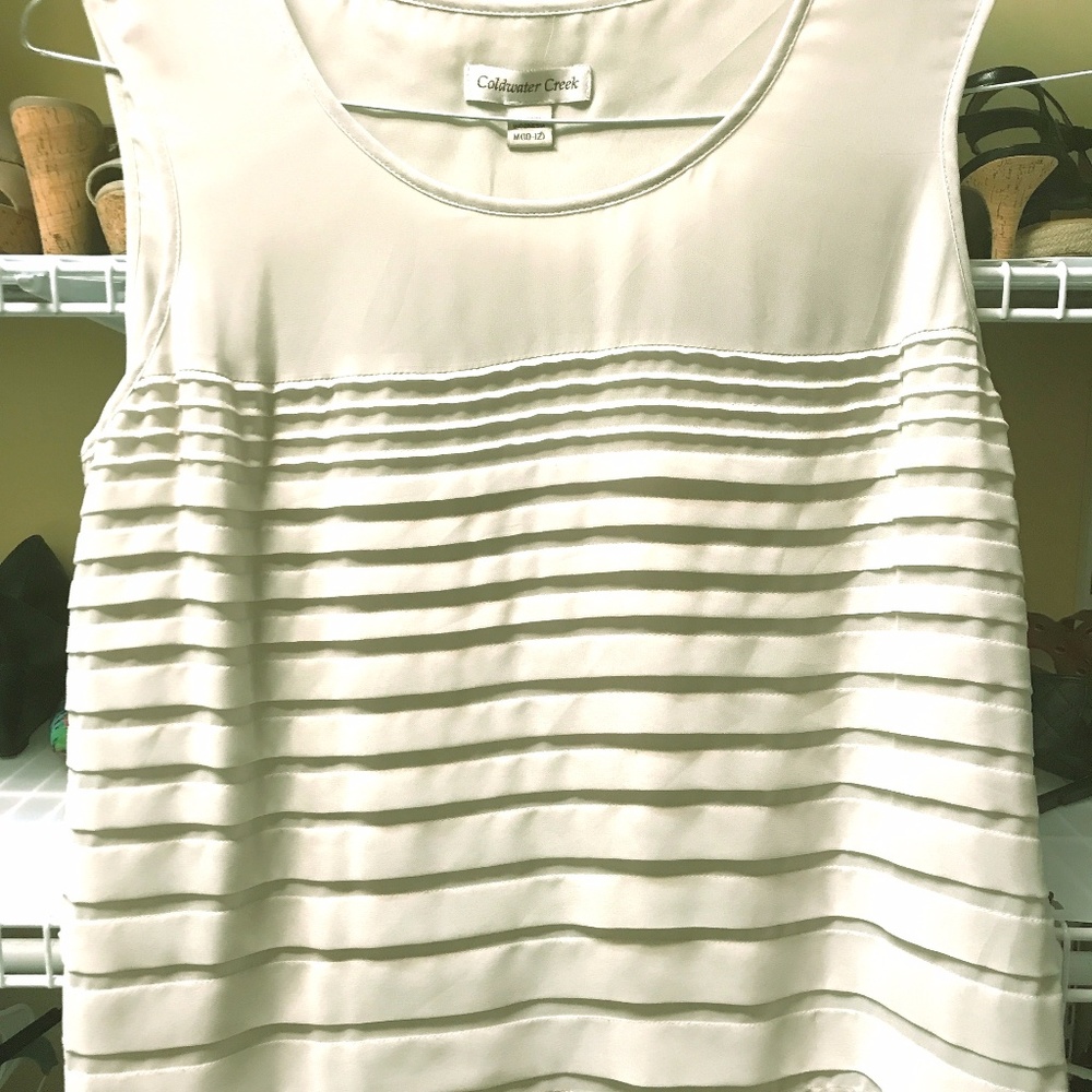 Cream-colored shell. Flattering, machine-wash!