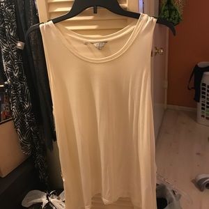 Beige tank top with little bling on the side.