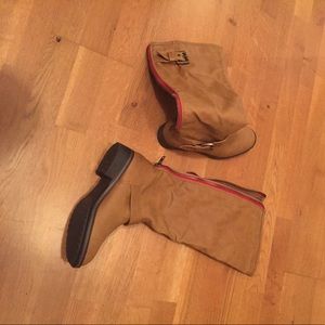 Tan boots wide legged.