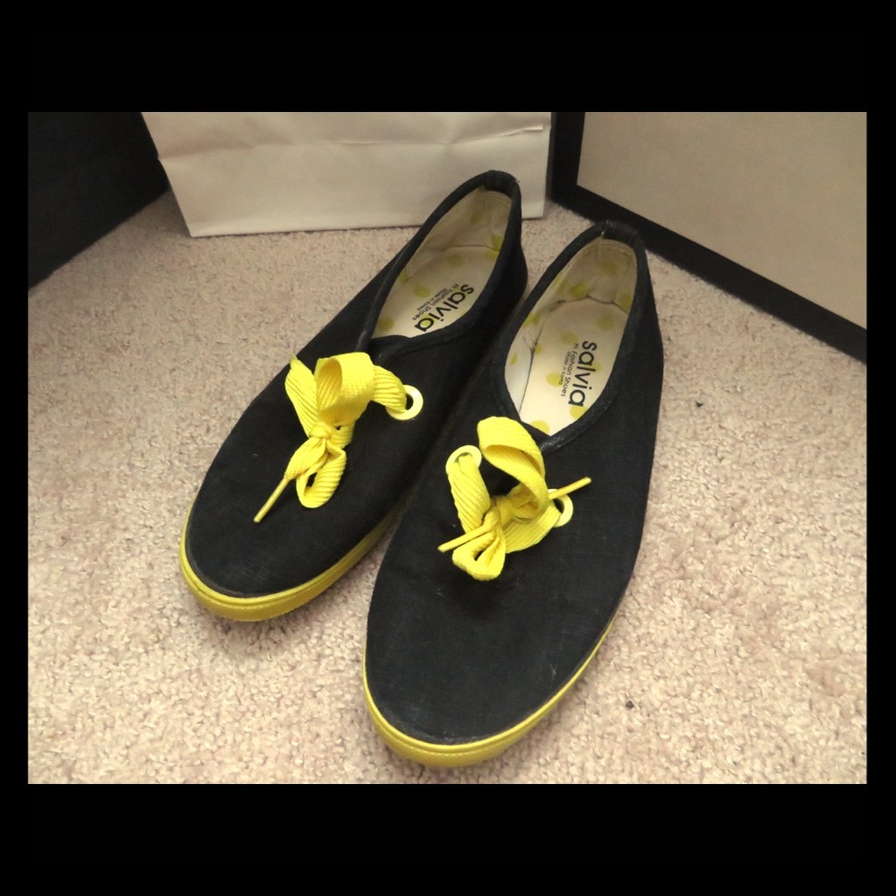 Black and yellow tennis shoes