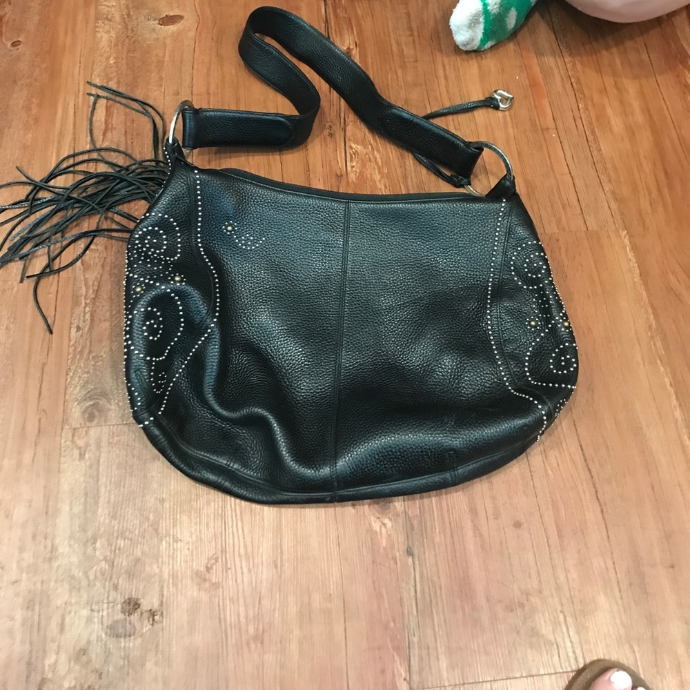 black shoulder purse with studs and is leather