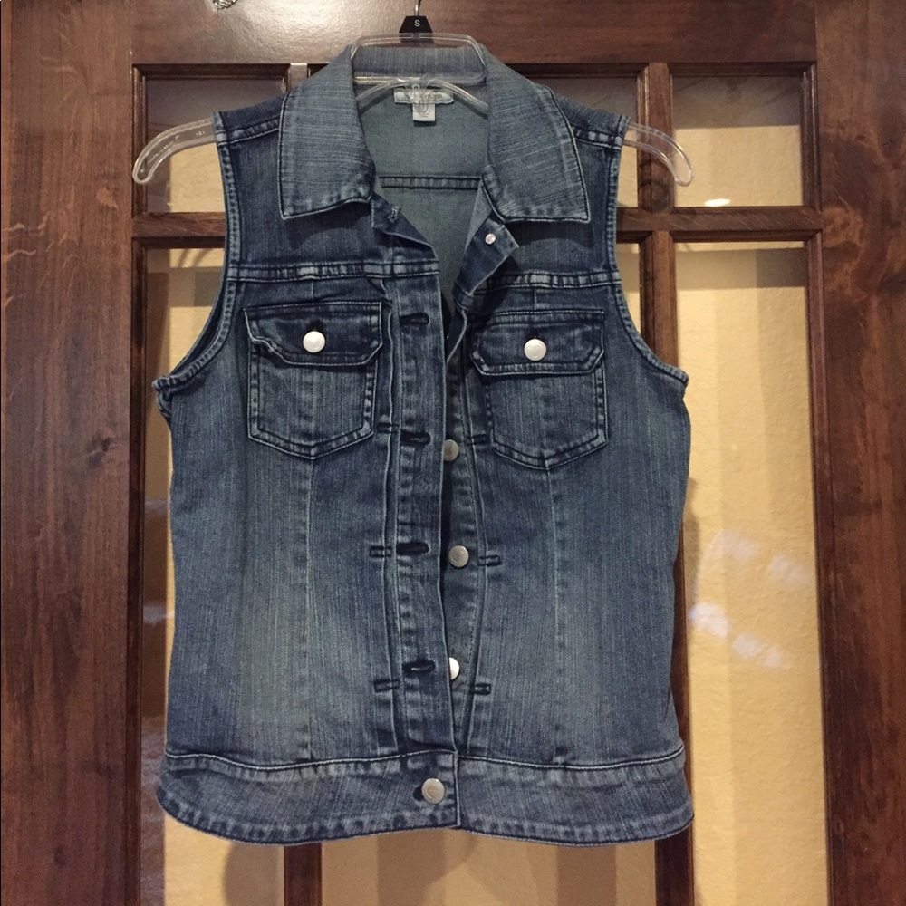 Sleeveless denim vest.