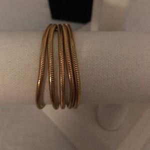 Five strand gold tone bracelet