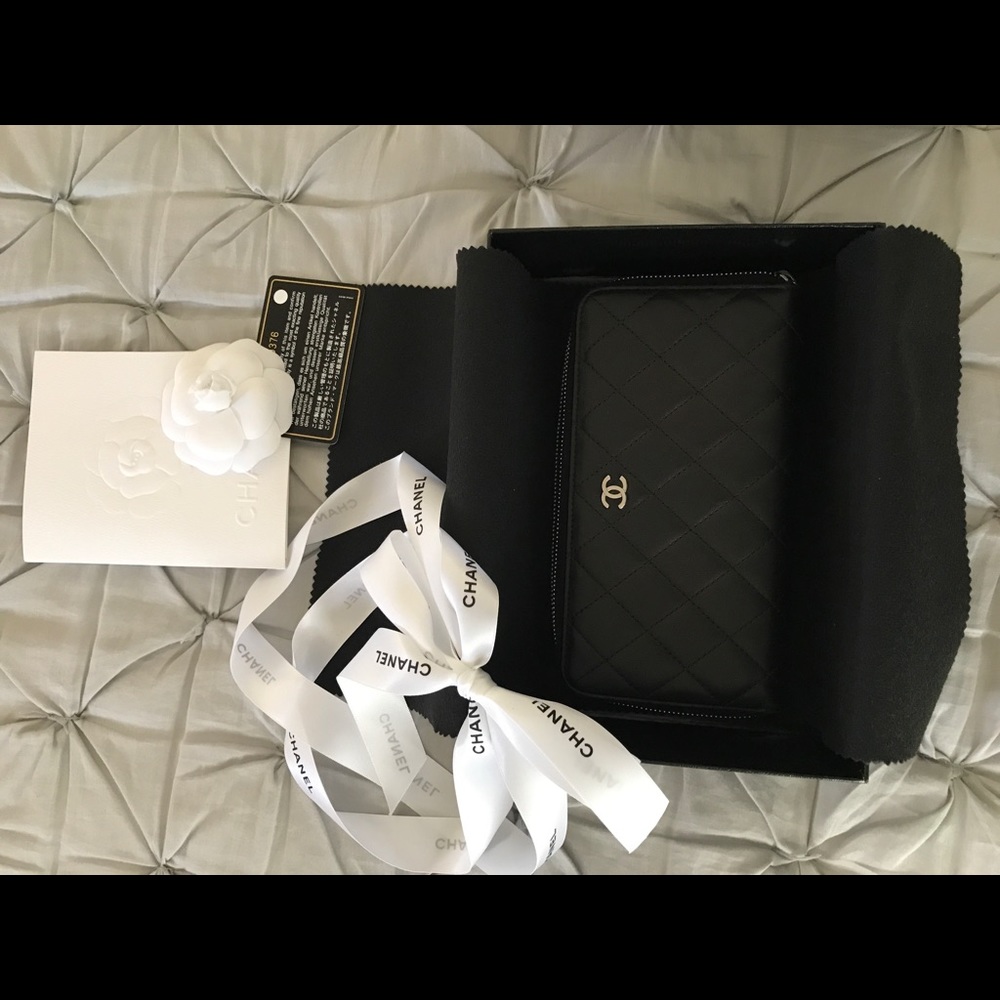 100% authentic Chanel lambskin zip around wallet.