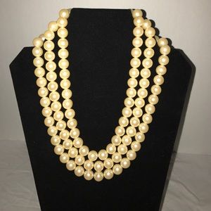 Triple strand faux pearl necklace