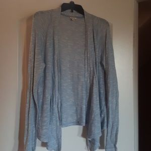 Blue sweater lower in front than back