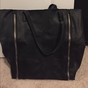 Black leather purse with silver zippers