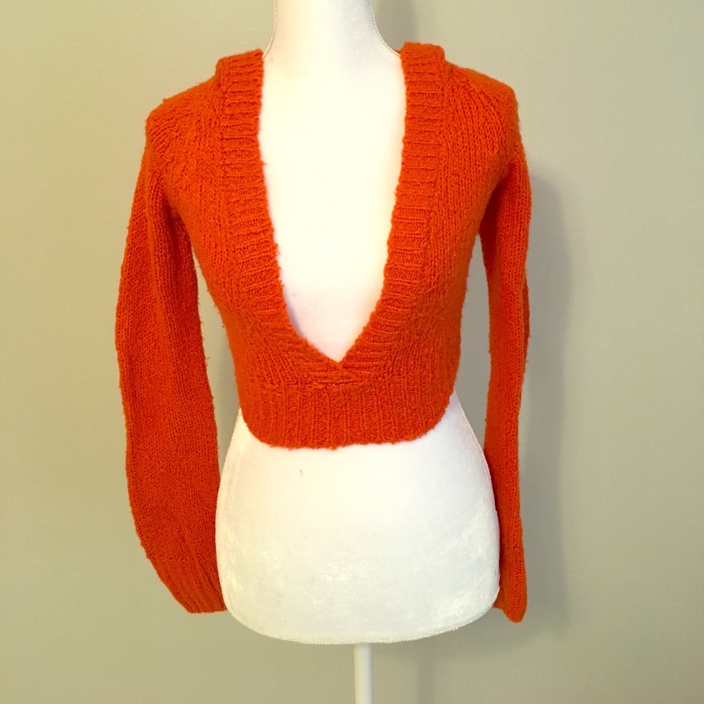 Super soft cropped hooded orange sweater.