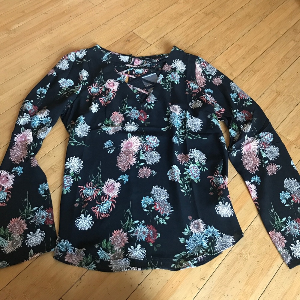 Blk floral blouse cross cross