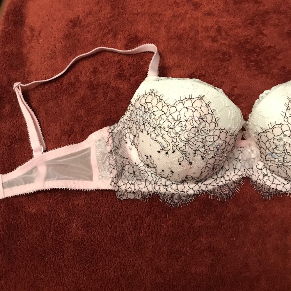 VS pink, white, and black lace and crystal bra