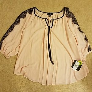 Blush blouse with black piping and decoration