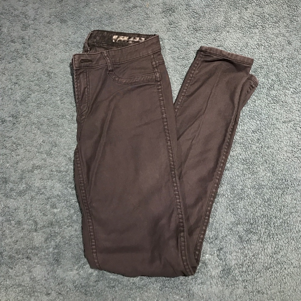 Reversible black/patterned Calvin Klein jeans.