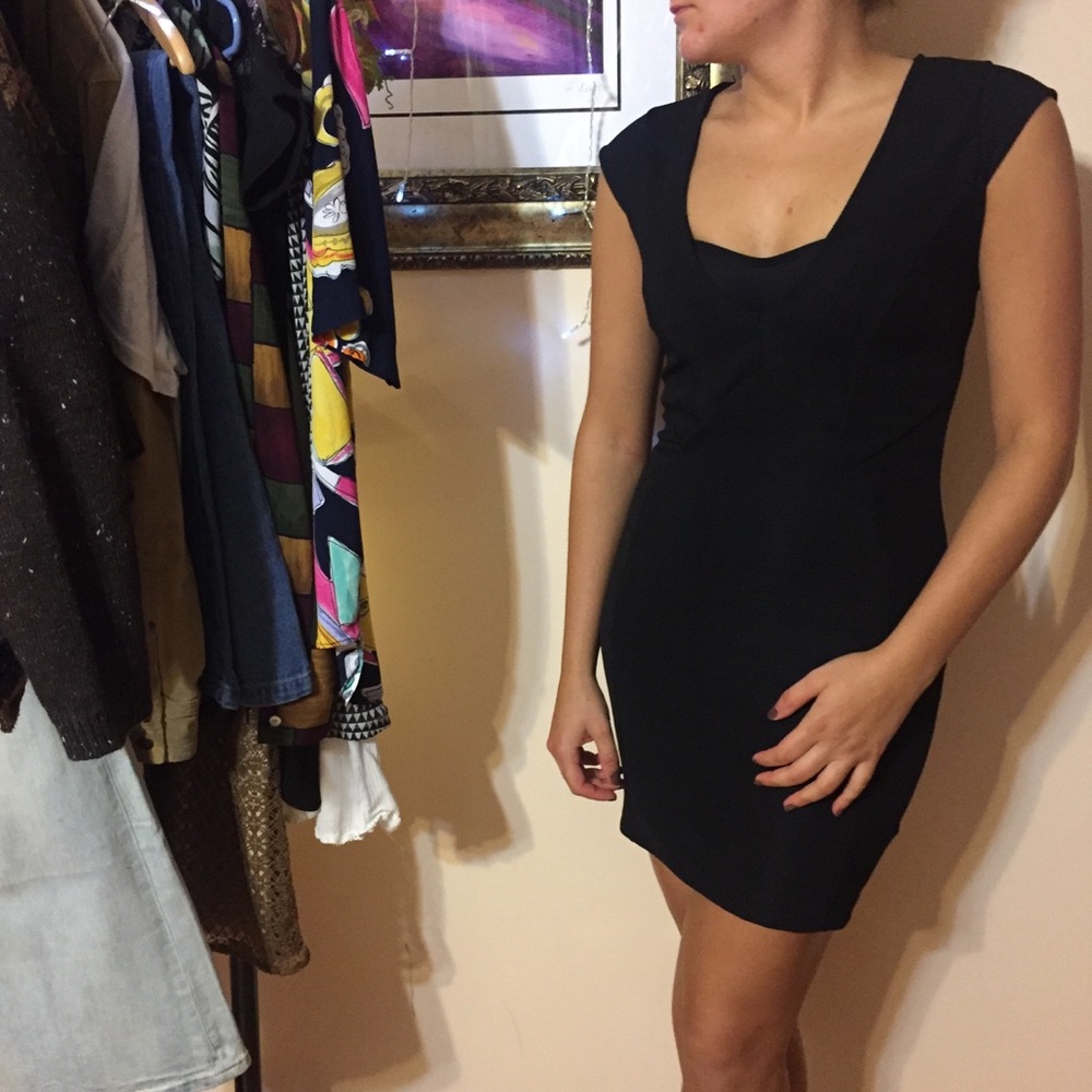 Tight deep cut black dress