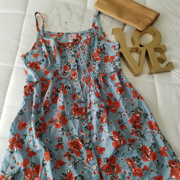 Dolled Up Tops - Spaghetti strap floral print blouse.