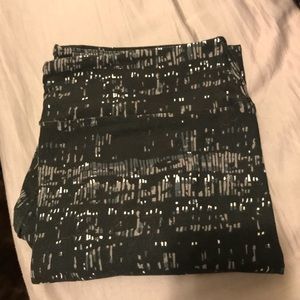 LulaRoe TC Leggings. Black background