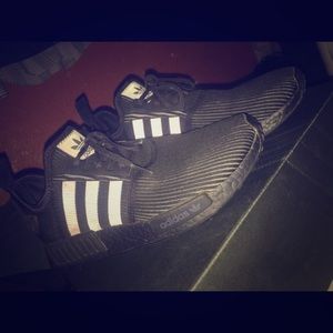 Triple black nmds reflective