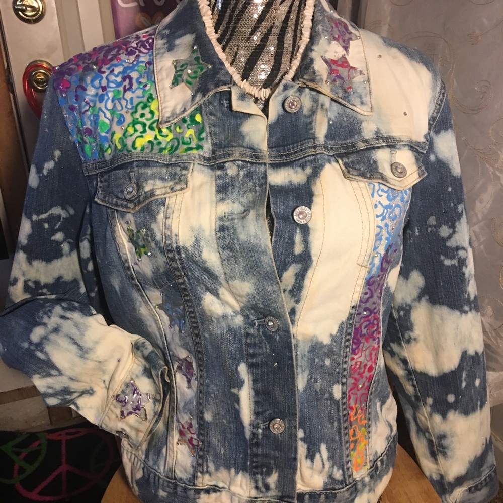 Jean jacket with rainbow leopard print appliqué.