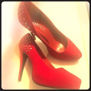 Red suede pumps