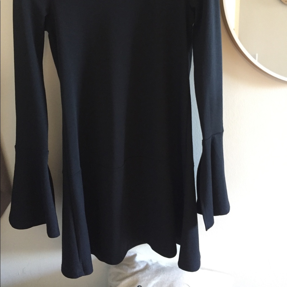 A lovely black dress. Never used.
