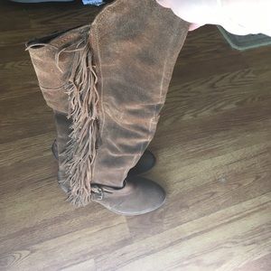 Knee high fringe boots