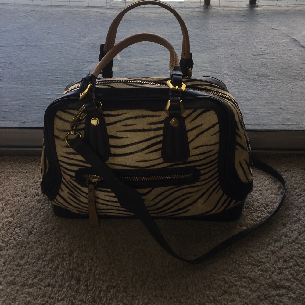 orYani Zebra purse gold metal details.