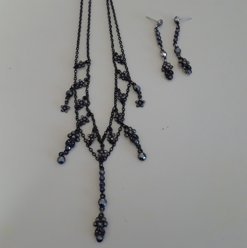 Woman's black necklace and earrings