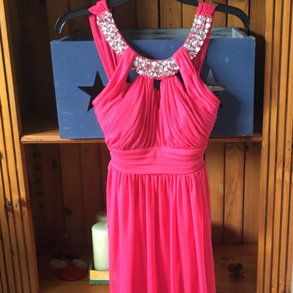 Bright beautiful flowing dress with sparkle neck.